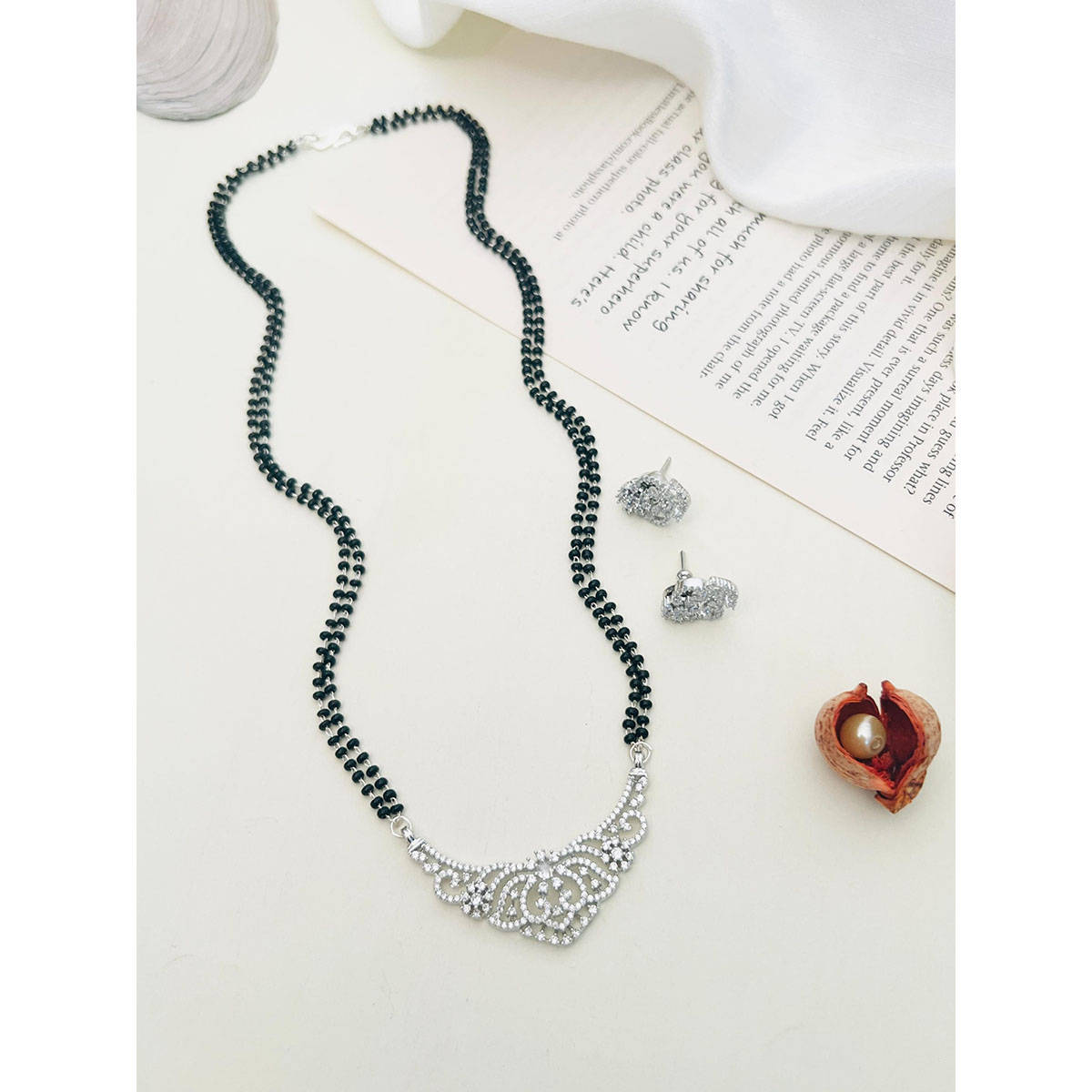 Abdesigns American Diamond Studded Beaded Mangalsutra with Pair Of Earrings (Set of 2) White · One Size