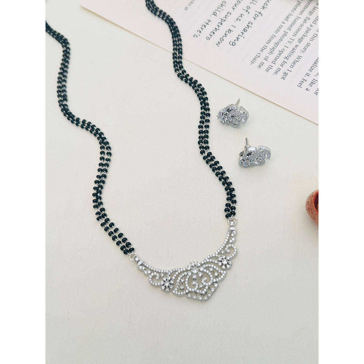 Abdesigns American Diamond Studded Beaded Mangalsutra with Pair Of Earrings (Set of 2) White