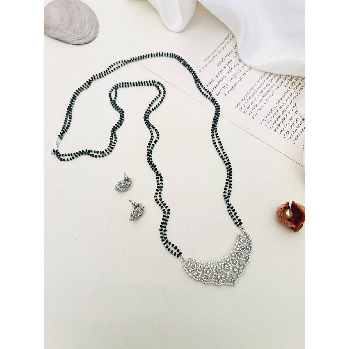 Abdesigns American Diamond Studded Beaded Mangalsutra with Pair Of Earrings (Set of 2) White