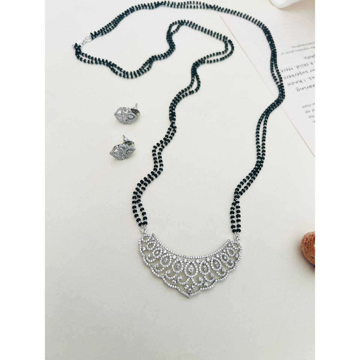 Abdesigns American Diamond Studded Beaded Mangalsutra with Pair Of Earrings (Set of 2) White