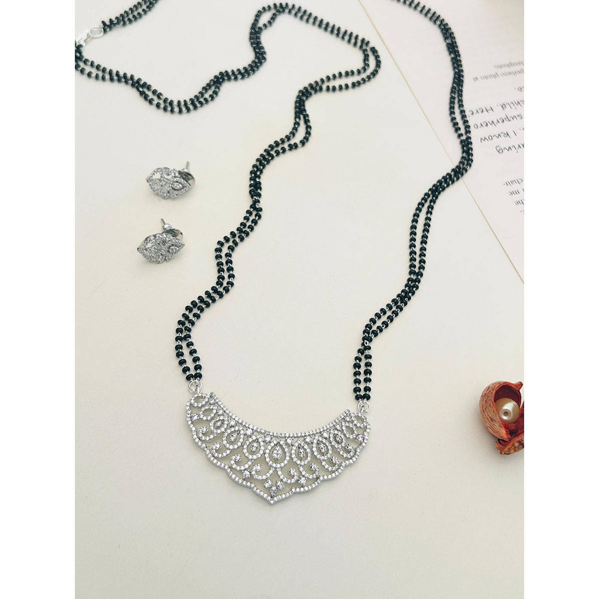 Abdesigns American Diamond Studded Beaded Mangalsutra with Pair Of Earrings (Set of 2) White