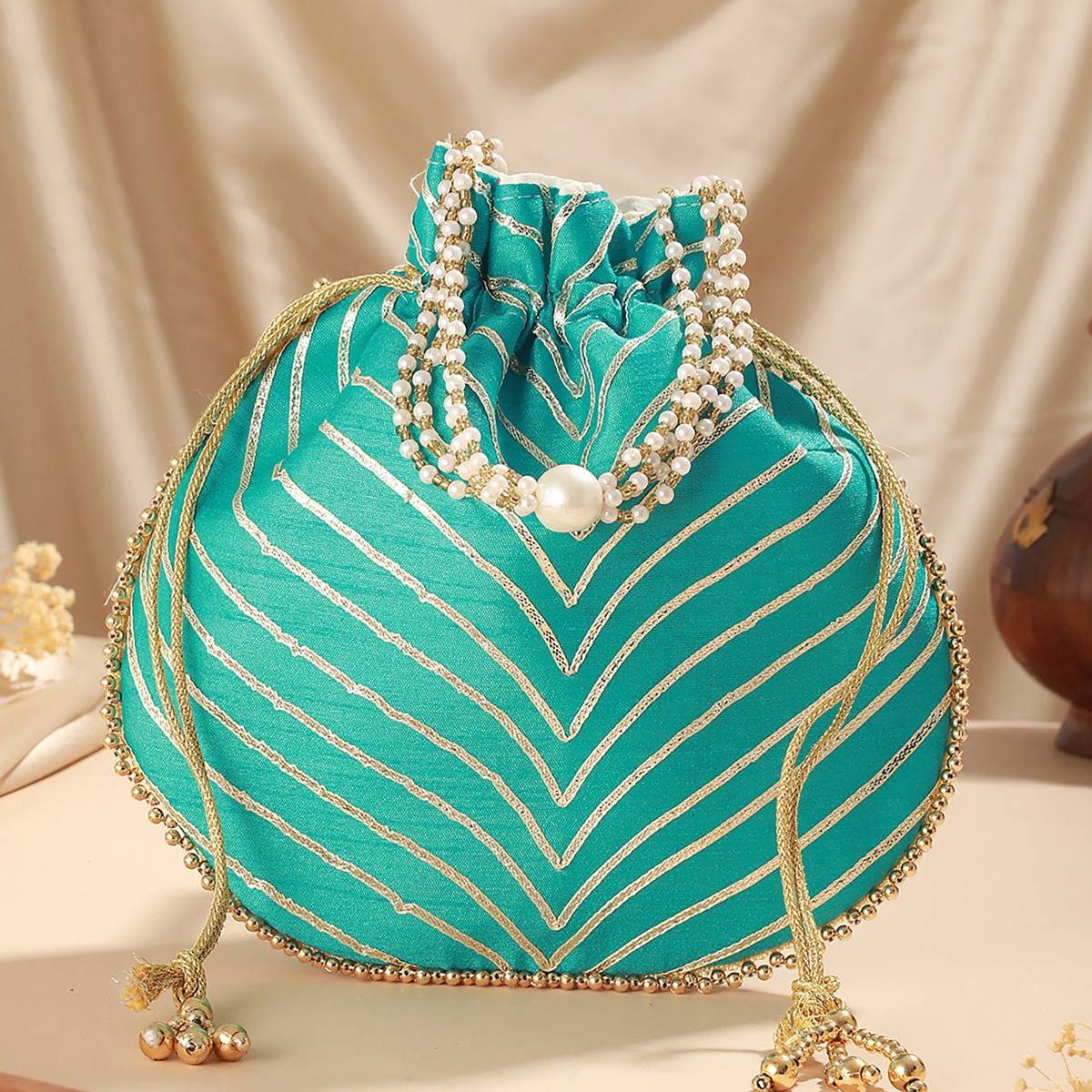Aatmana Sky Blue & Gold Embellished Potli Bag · One Size