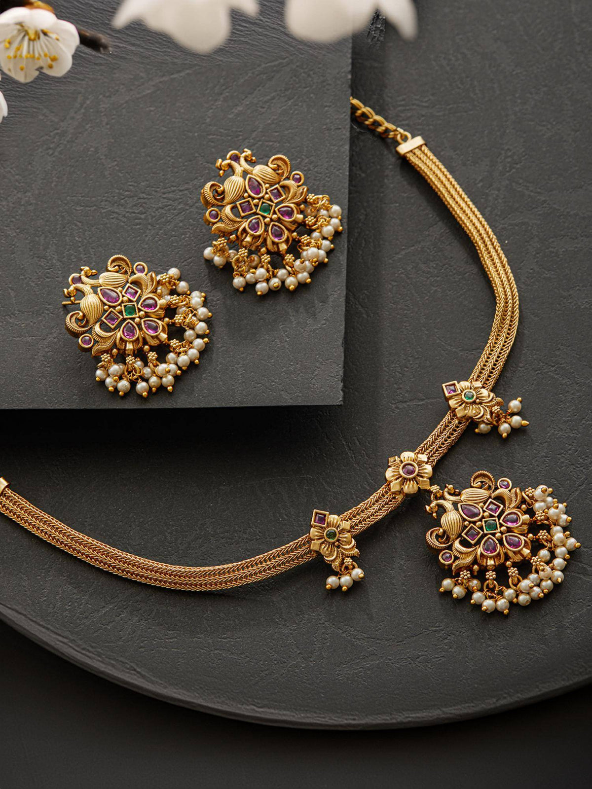 Aatmana 22K Gold Plated Ruby And Green Kemp Stone Studded Peacock Shaped Temple Jewellery Set