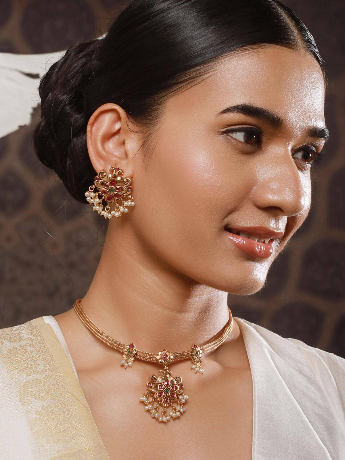 Aatmana 22K Gold Plated Ruby And Green Kemp Stone Studded Peacock Shaped Temple Jewellery Set