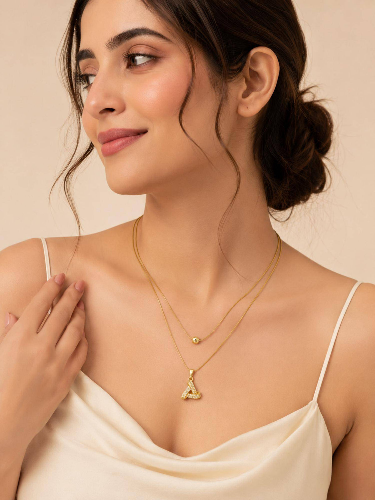 AANURA 18K Gold Plated Crystal Ribbon Loop Layered Necklace