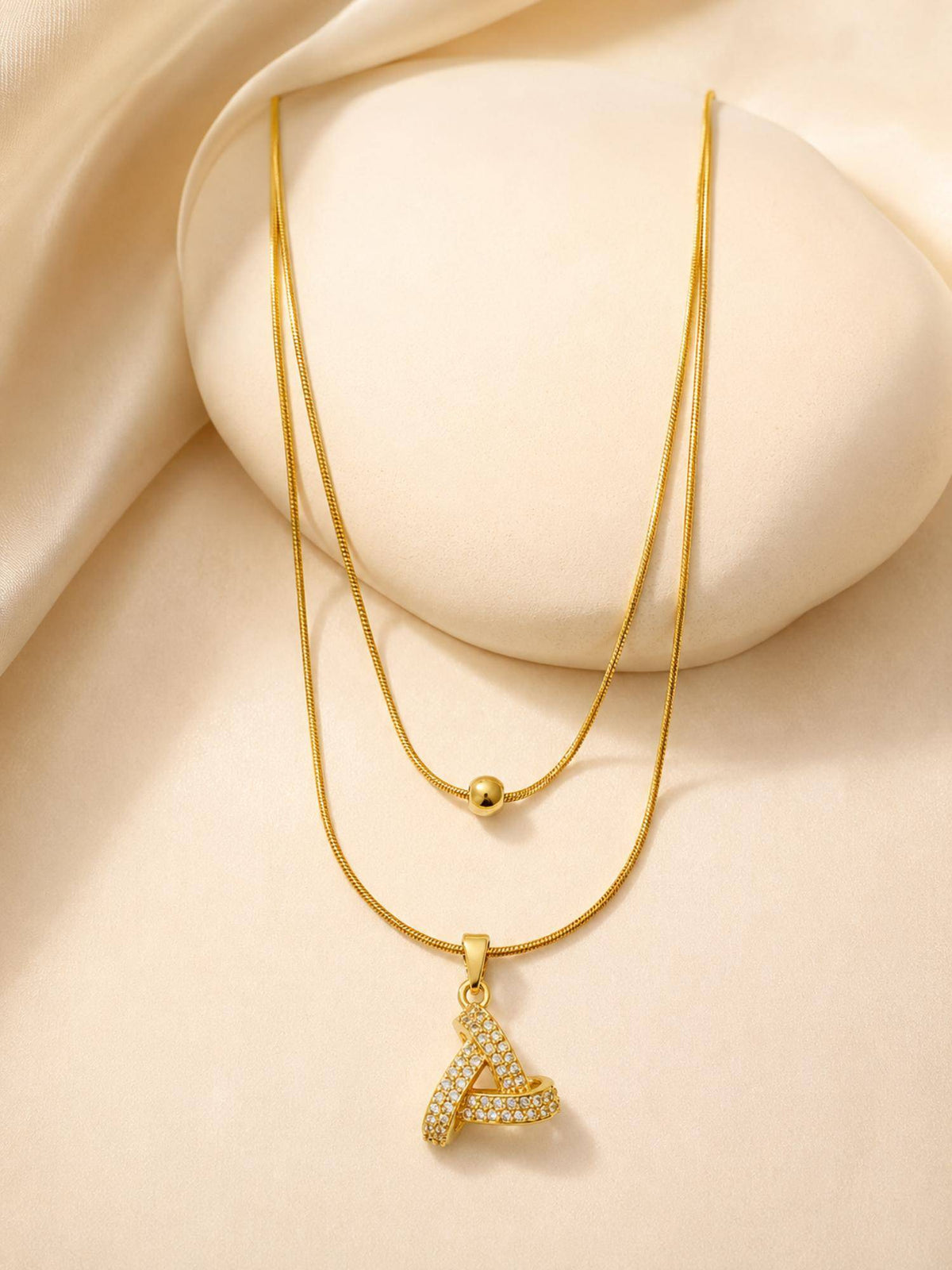 AANURA 18K Gold Plated Crystal Ribbon Loop Layered Necklace
