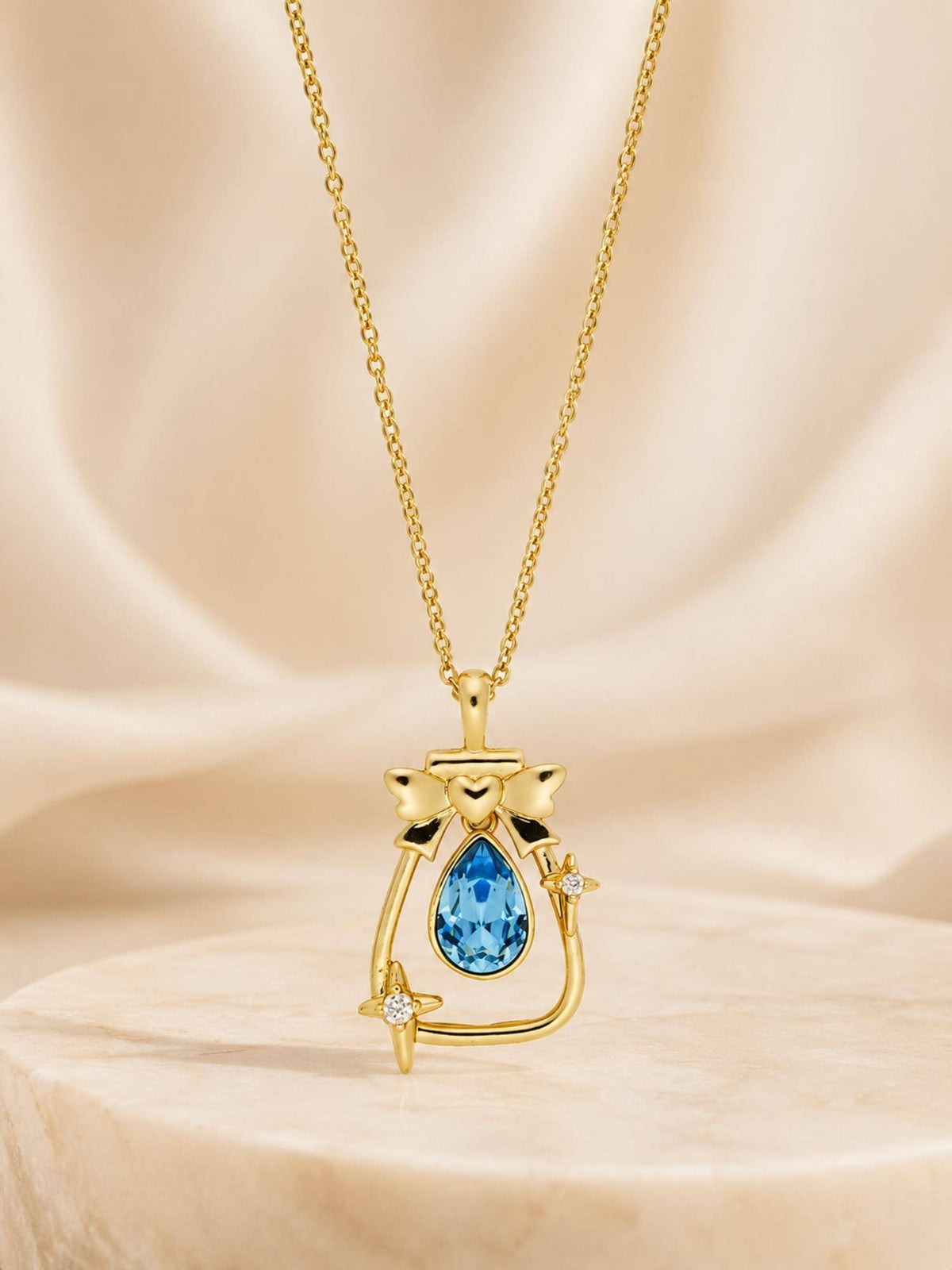 AANURA 18K Gold Plated Sea Blue Teardrop Bow Charm Necklace