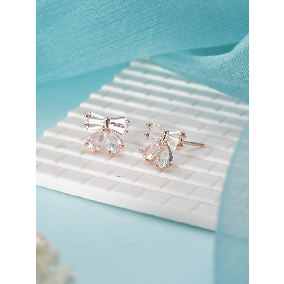 Aatmana Rose Gold Plated American Diamond Studded Bow Shaped Contemporary Studs · One Size
