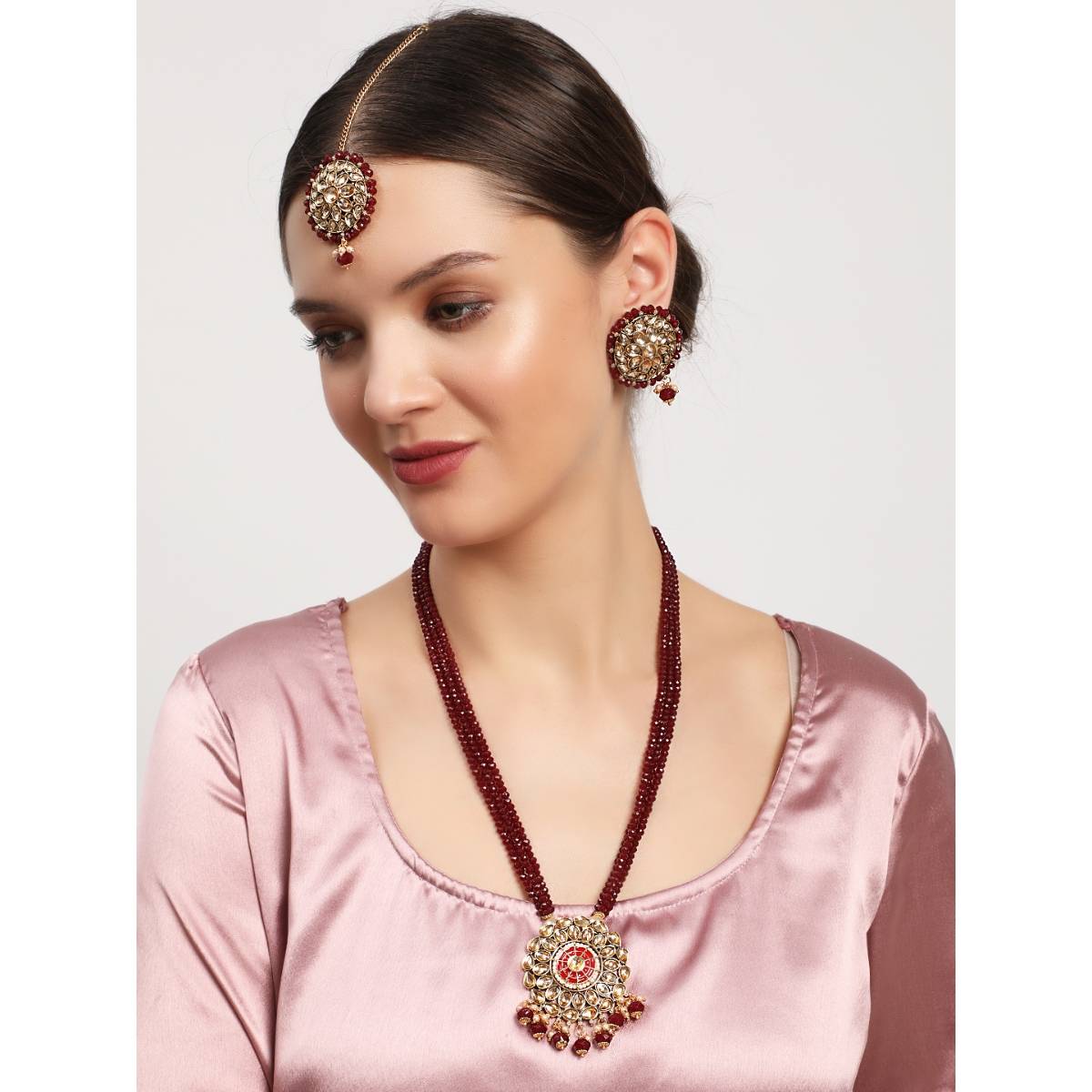 Aatmana Gold Plated Kundan Studded Maroon Beaded Multi Strand Jewellery Set with Maangtikka