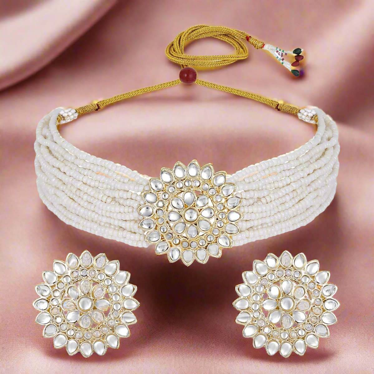 Aatmana Gold Plated Kundan Studded Beaded White Floral Necklace and Earrings