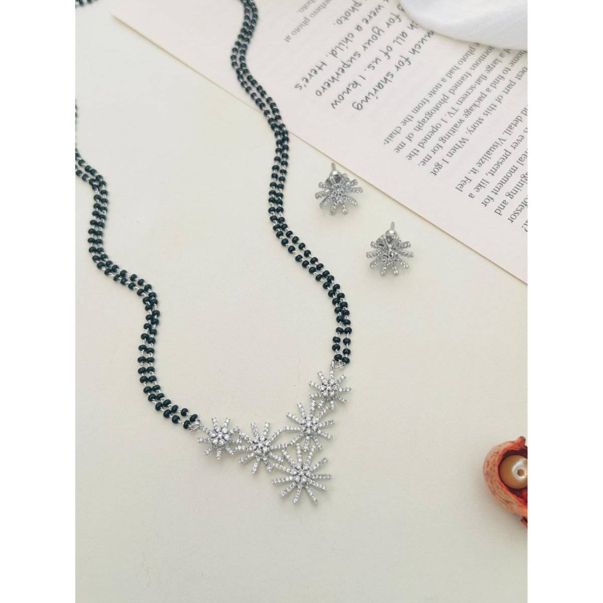 Abdesigns White Silver Plated American Diamond Studded Beaded Mangalsutra with Pair Of Earrings