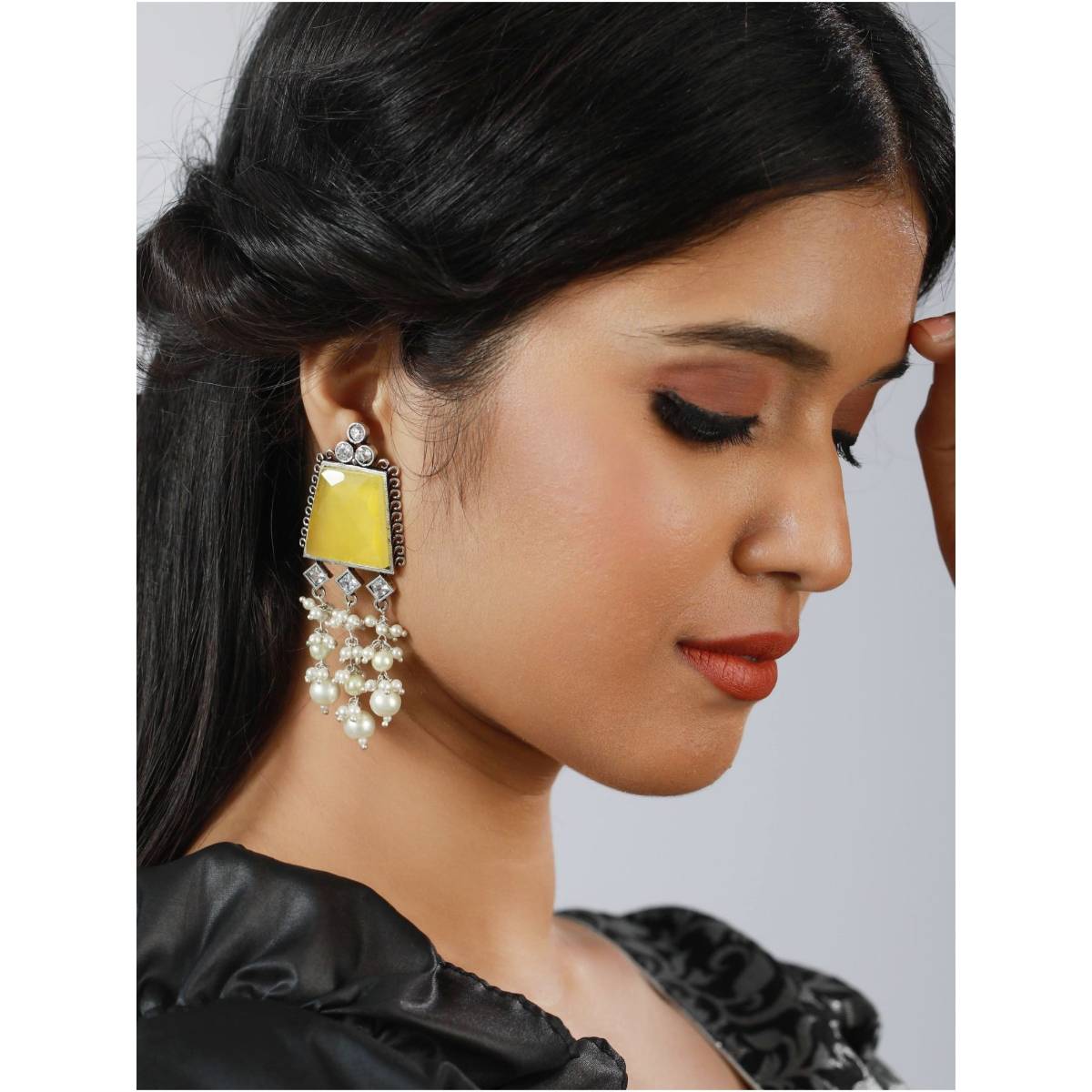 Aatmana Silver Toned Yellow Stone and Ad Studded Contemporary Drop Earrings
