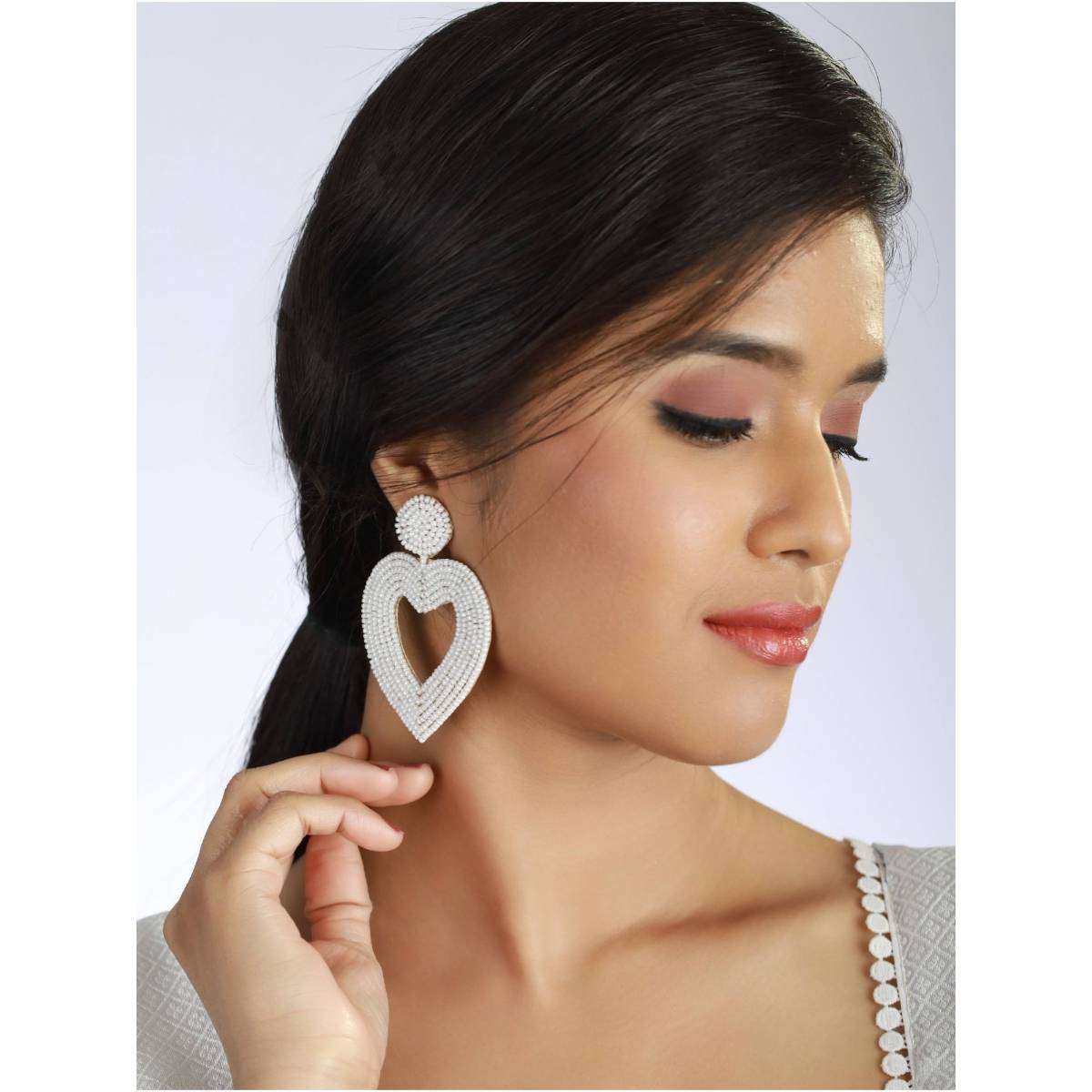 Aatmana Handwoven Beads and White Heart Shaped Contemporary Handcrafted Drop Earrings