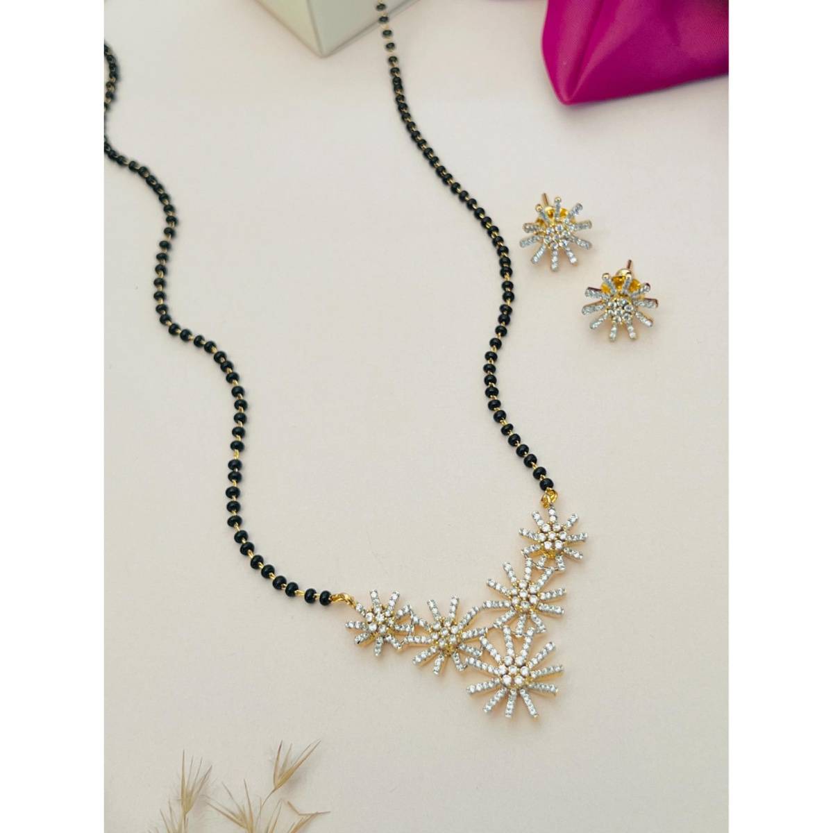 Abdesigns White Silver Plated American Diamond Studded Mangalsutra with Earrings
