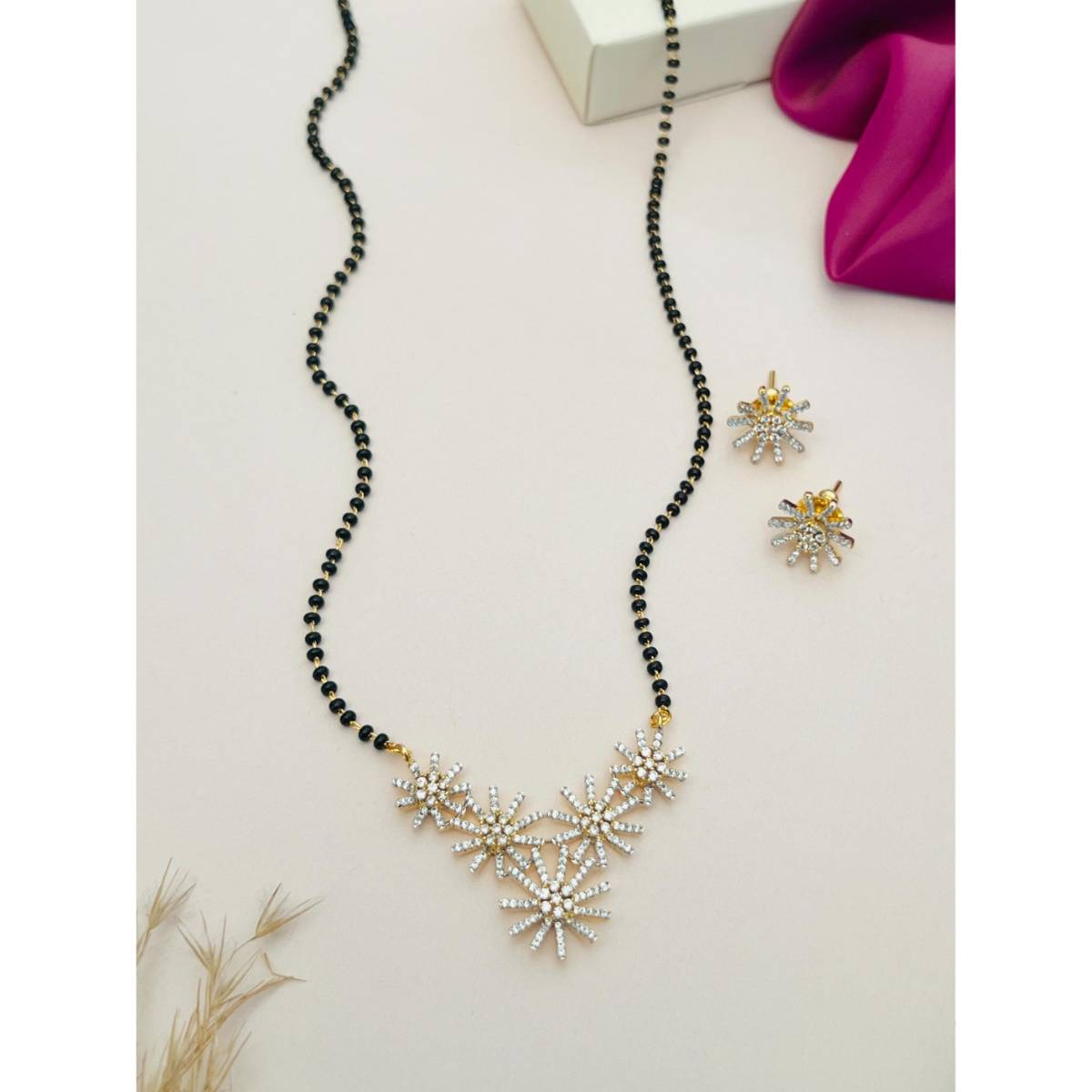 Abdesigns White Silver Plated American Diamond Studded Mangalsutra with Earrings
