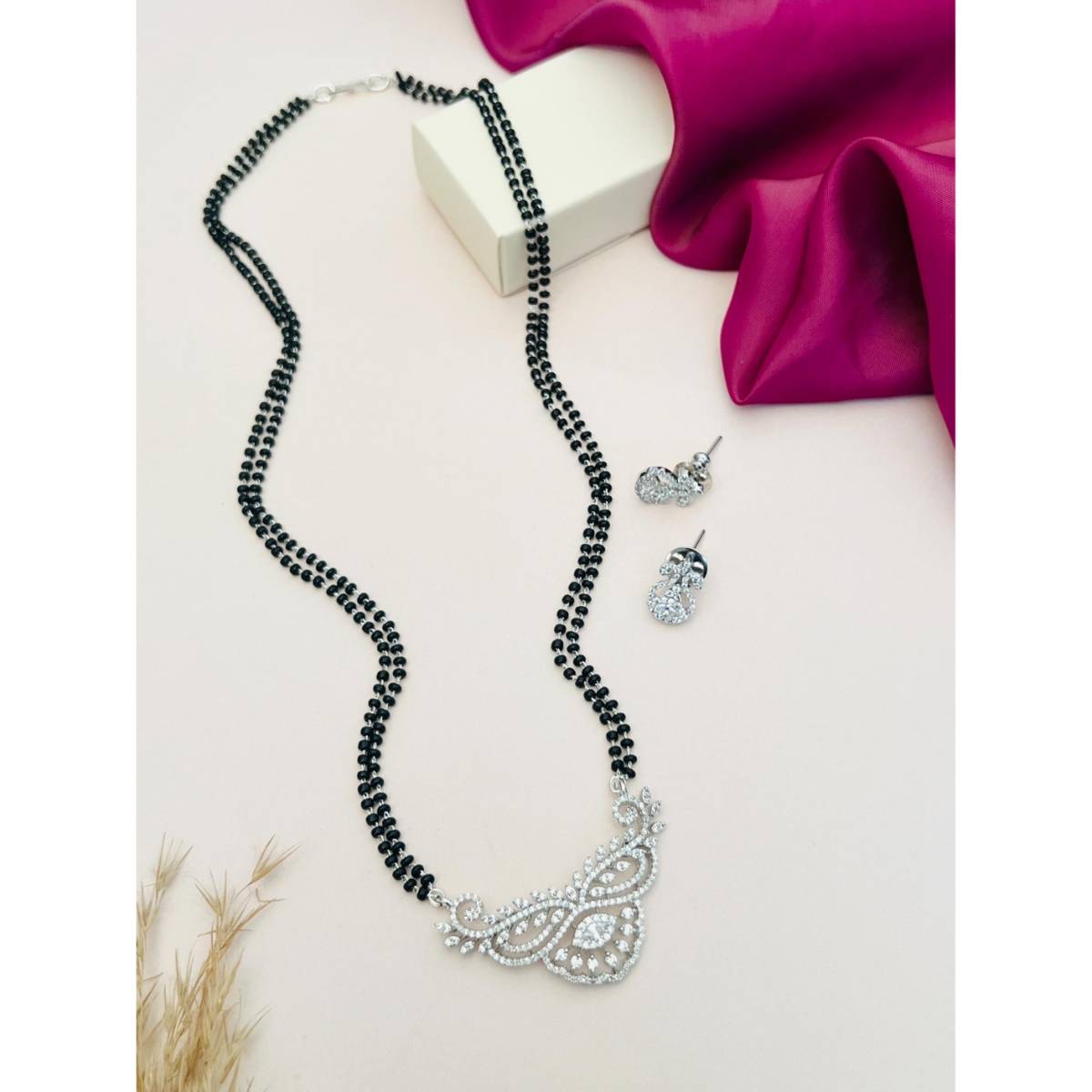 Abdesigns White Silver Plated American Diamond Studded Mangalsutra with Earrings