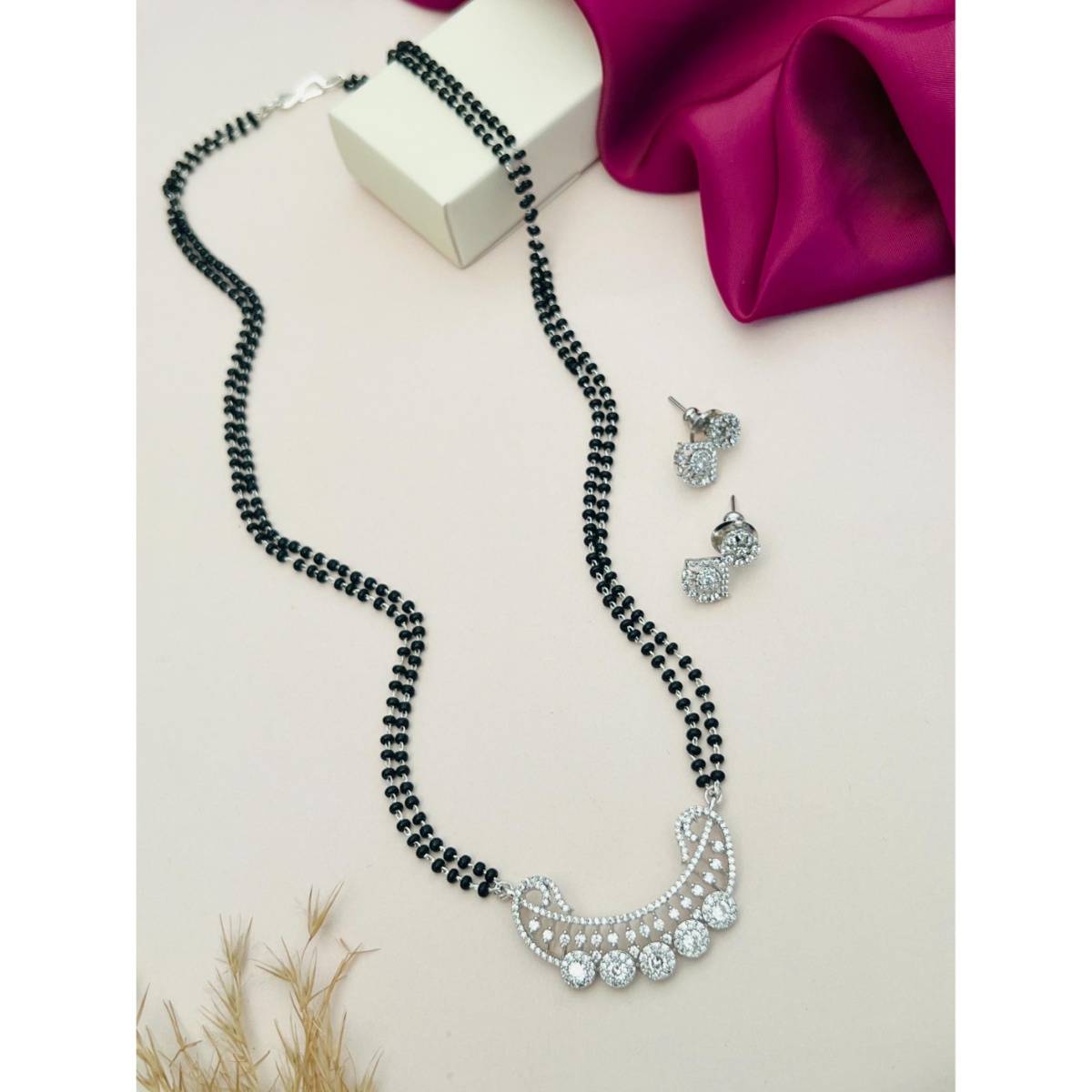 Abdesigns White Silver Plated American Diamond Studded Mangalsutra with Earrings
