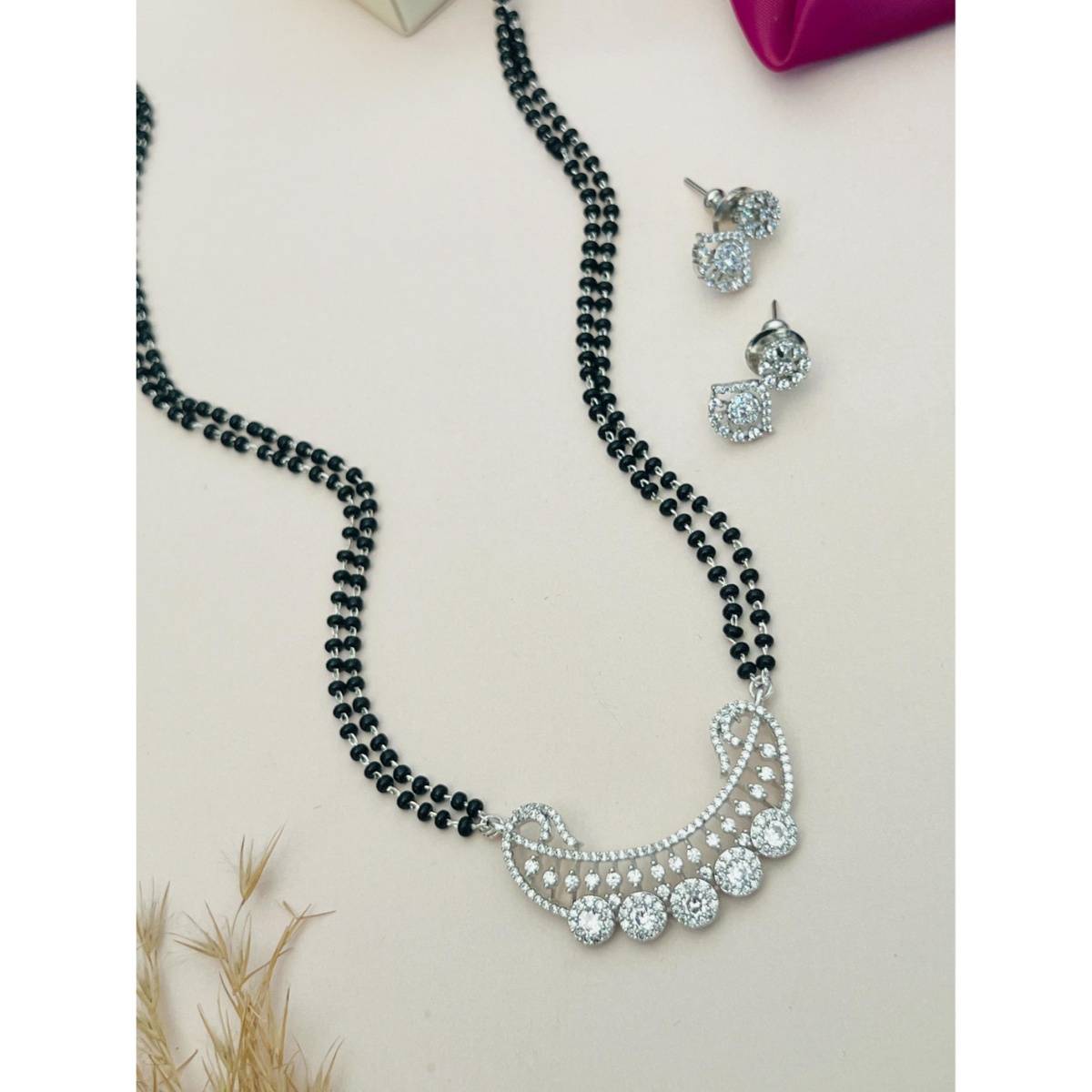 Abdesigns White Silver Plated American Diamond Studded Mangalsutra with Earrings