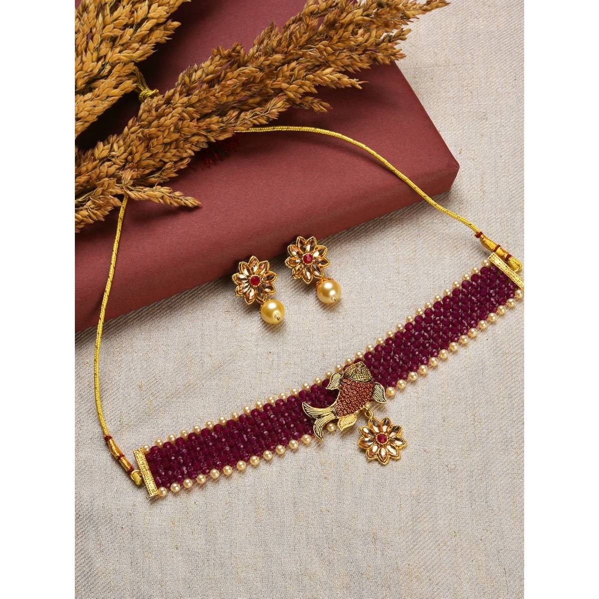 Aatmana Gold Toned & Maroon Fish Studded & Beaded Jewellery Set